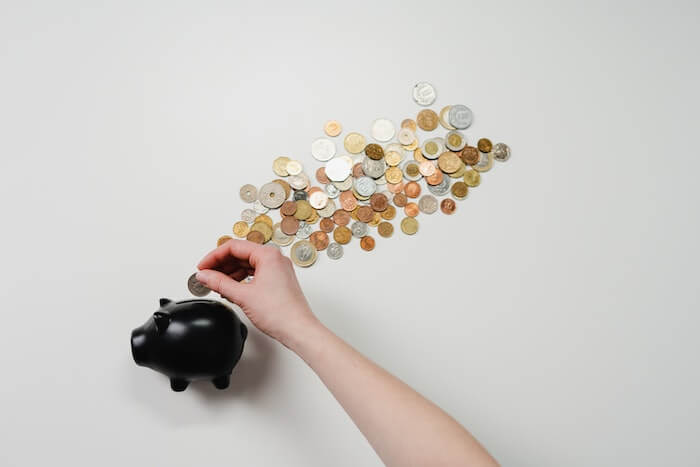 Refunded money in a piggy bank savings
