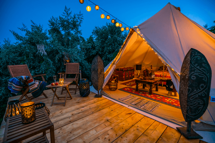A glamping business tent which offers more comfort and amenities than typical bare-bones camping