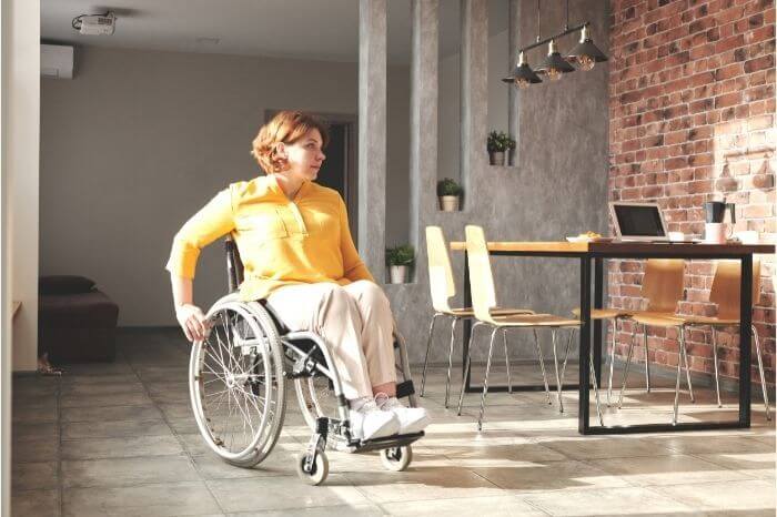 a woman moving around a wheelchair accessible vacation rental
