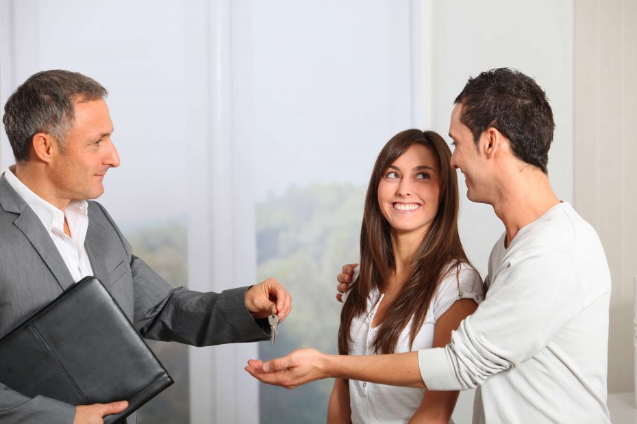 Property managers receiving a key for a purchased apartment